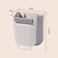 🗑️ 50% DE RÉDUCTION! 🧺 Poubelle Suspendue & Pliable Multifonctionnelle pour la Cuisine – Gain de Place, Robuste & Parfaite Pour Les Épluchures & Déchets Recyclables ♻️