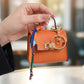 👛 PROMO FLASH 50 % ! 🌸 Porte-Monnaie Mini Porte-Clés Compact – Cuir PU Texturé, Fermoir Ton Or, Ruban Décoratif, 12 Couleurs 🏆