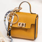 👛 PROMO FLASH 50 % ! 🌸 Porte-Monnaie Mini Porte-Clés Compact – Cuir PU Texturé, Fermoir Ton Or, Ruban Décoratif, 12 Couleurs 🏆