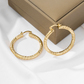 Boucles d'oreilles créoles torsadées élégantes pour femmes